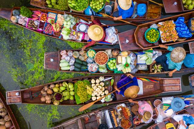 Aerial view of Damnoen Saduak floating market boat with fruits and vegetables